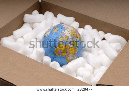 The World Globe In A Shipping Carton With Packaging Peanuts
