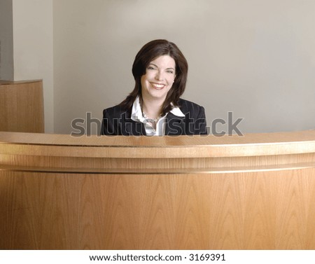 Modern Hotel Check In Desk, With Smiling Receptionist