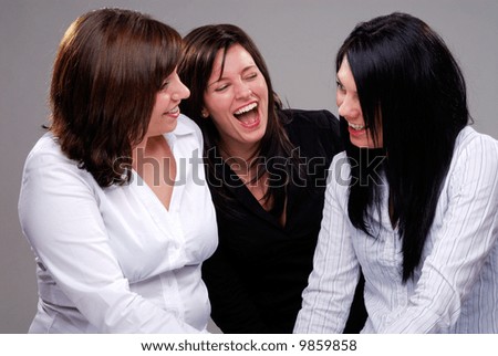Three Women Having A Good Time Chatting And Laughing