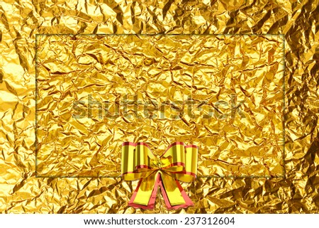 Shiny yellow leaf gold  ribbon on Shiny foil texture background