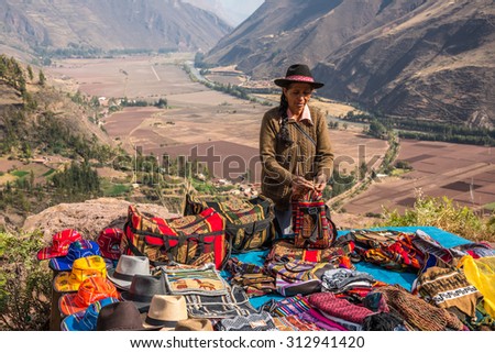 CUZCO, PERU - CIRCA 2015: A woman sell handycrafts in the sacred Valley circa 2015, in Cuzco, Peru.
