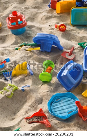 a sand box with a toys is in a supermarket