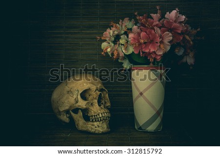 Still Life with a Skull and old Flower vintage tone