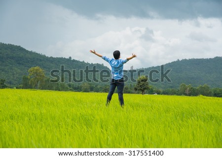 Young man freedom in nature,rice field