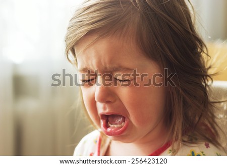 Cute little child is crying