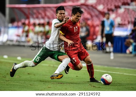 Kallang,Singapore JUNE15:MAC Hong Quan(Red) of Vietnam in action during the 28th SEA Games Singapore 2015 match between Vietnam and Indonesia at Singapore National Stadium on JUNE15 2015