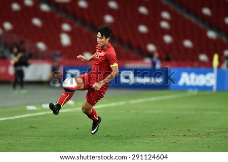 Kallang,Singapore JUNE15:MAC Hong Quan of Vietnam in action during the 28th SEA Games Singapore 2015 match between Vietnam and Indonesia at Singapore National Stadium on JUNE15 2015