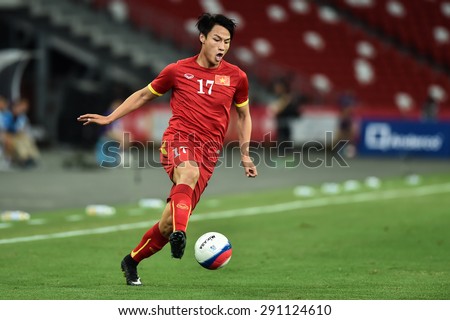 Kallang,Singapore JUNE15:MAC Hong Quan of Vietnam in action during the 28th SEA Games Singapore 2015 match between Vietnam and Indonesia at Singapore National Stadium on JUNE15 2015