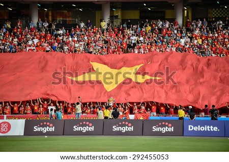 Kallang,Singapore - JUNE 13:Unidentified fans of Vietnam national supporters during the 28th SEA Games Singapore 2015 match between Vietnam and Myanmar at Singapore National Stadium on JUNE13 2015