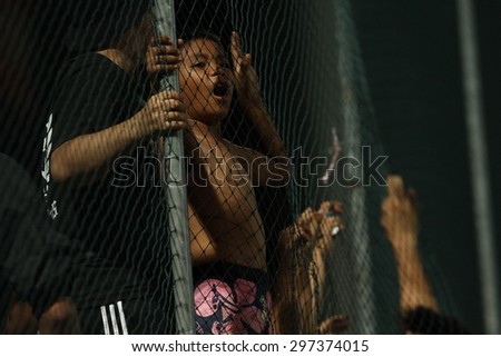 ANGKOK THAILAND- JULY 15 :Unidentified fans of Thai Port Fc in action during Thai Premier League between Thai Port Fc and Nakhon Ratchasima F.C. at PAT Stadium on July15,2015 in Bangkok Thailand