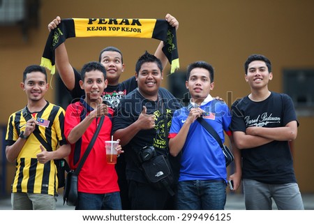KUALA LUMPUR MALAYSIA DEC20:Unidentified fans of Malaysia during the AFF Suzuki Cup 2014 between Malaysia and Thailand at Bukit Jalil National Stadium on December 20,2014 in Kuala Lumpur,Malaysia.