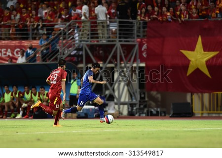 BISHAN,SINGAPORE-JUNE 10:Pinyo Inpinit of Thailand in action during the 28th SEA Games Singapore 2015 match between Thailand and Vietnam at Bishan Stadium on JUNE 10 2015 in,SINGAPORE.