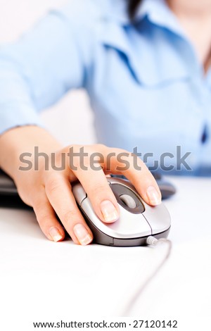 Female hands working on the computer.