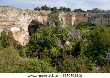 Ancient stone cave dwellings at Syracuse, Sicily, Italy