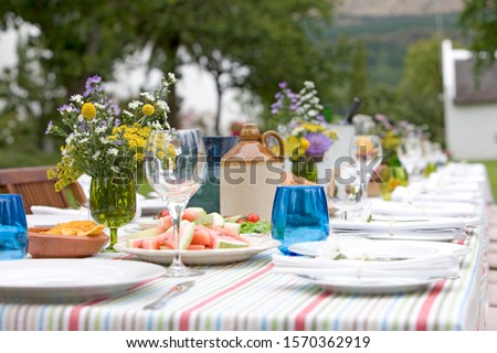 Similar – Image, Stock Photo set garden table with fairy lights in play of light and shadow