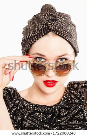 Glamorous young woman in sunglasses, portrait