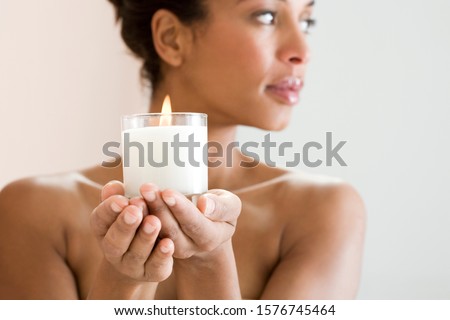 Similar – Image, Stock Photo Woman holding a candle at night, during the Easter celebrations