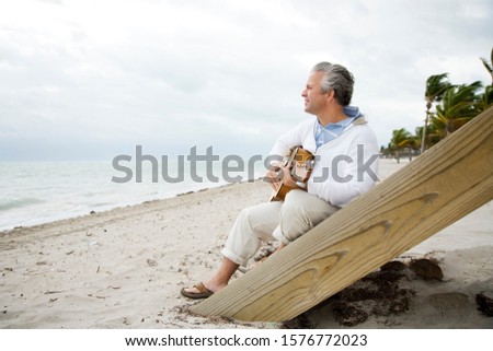 A senior man playing a guitar Stok fotoğraf © 