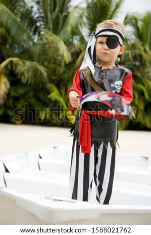 A young boy dressed as a pirate