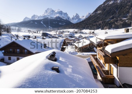 Roofs of the huts covered with snow after a snowfall