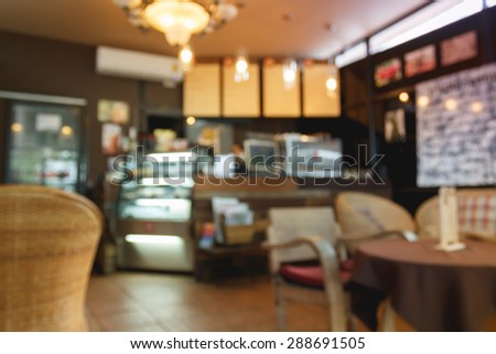 blurred cafe to sit and enjoy a drink for background.Warm tone photo.