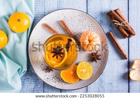 Similar – Image, Stock Photo Mandarine fruits and cinnamon sticks styled on blue cloth background, flat lay, winter theme