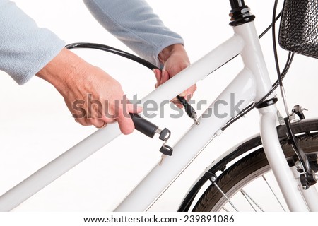 Securing the bike with a chain and key - studio shoot