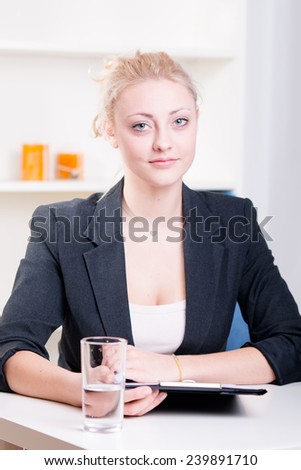 Pretty young woman at a job interview - studio shoot