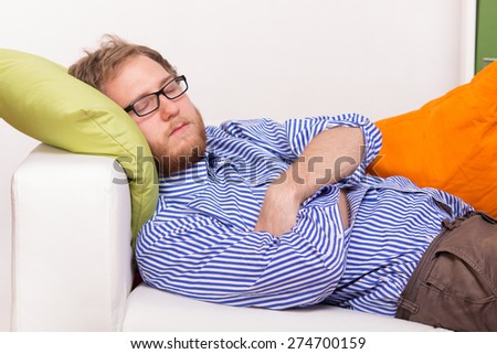 Young man sleeping on the couch