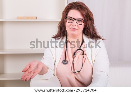 Young lady doctor is waiting for a patient in the office