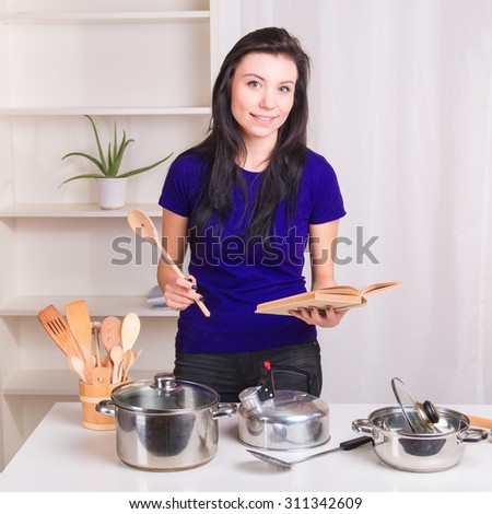 Young girl first time learns to cook at home