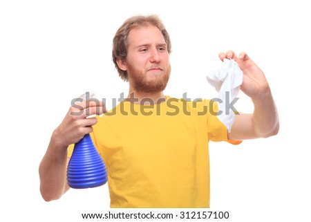 Bearded young man washes using spray and rubber - studio shoot