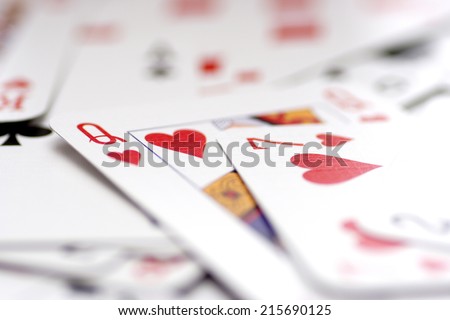 Playing card background. Focus on Queen of Hearts.