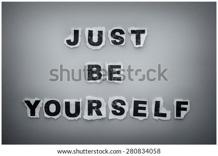 Just Be Yourself. Paper letters. Black and white image with vignette and white frame.