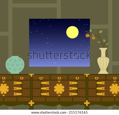 A persimmon branch decorates the pottery on the Korean traditional furniture. The full moon showed out of the window.