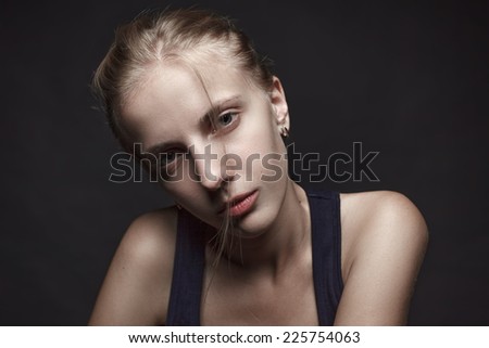 Face portrait of young woman without make-up.Black background.Natural image.