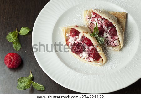 Pancakes stuffed with strawberries and ricotta.