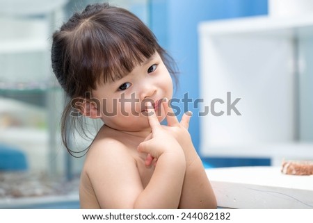 Asian girl without clothes sitting smiling happily acted ideally.