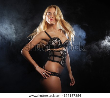 elegance lady in the lingerie dancing in the night club