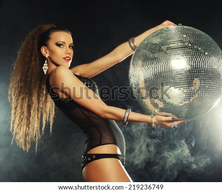 dancer girl in smoke with disco ball, night club
