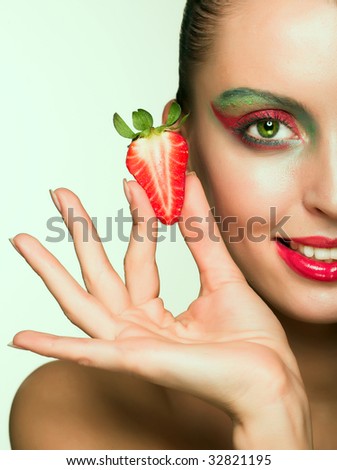 Beautyfull smiling girl with strawberry