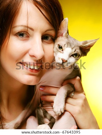 young woman with sphynx  cat