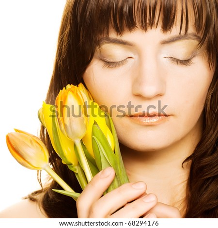 picture of happy woman with yellow tulips  over white