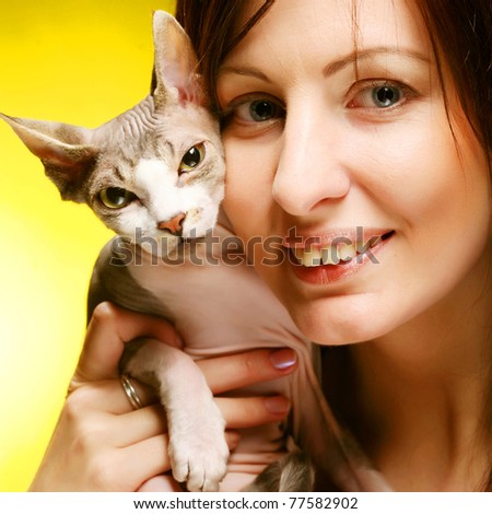 young woman with sphynx  cat