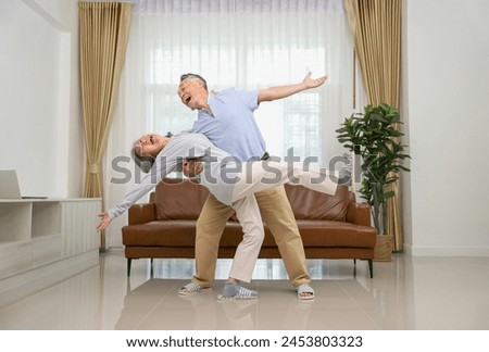 Similar – Image, Stock Photo Cheerful couple having fun with binocular on town observation deck