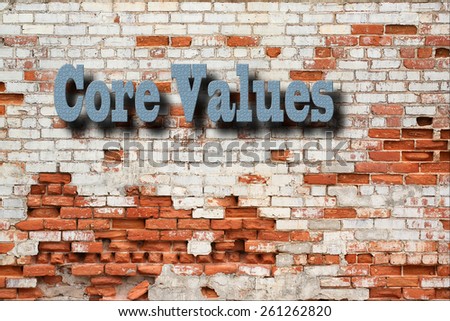 Core Values Concept - Core Values sign in blue on decaying brick wall outdoors
