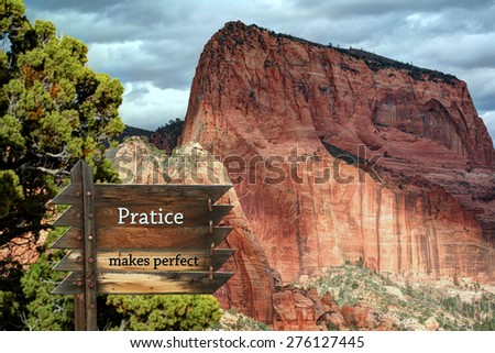 Practice makes perfect message on wood slats with mountain background