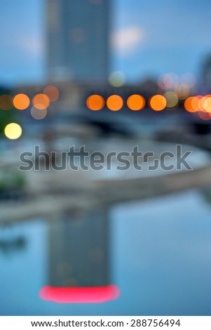 Blurred skyline at dusk with vibrant colors and interesting shapes