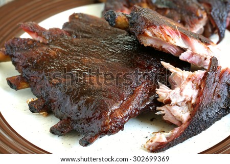 Rack of ribs ready to eat on plate
