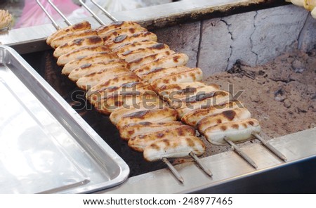 Grill banana in the metal stick , Asian local sweetmeat.
